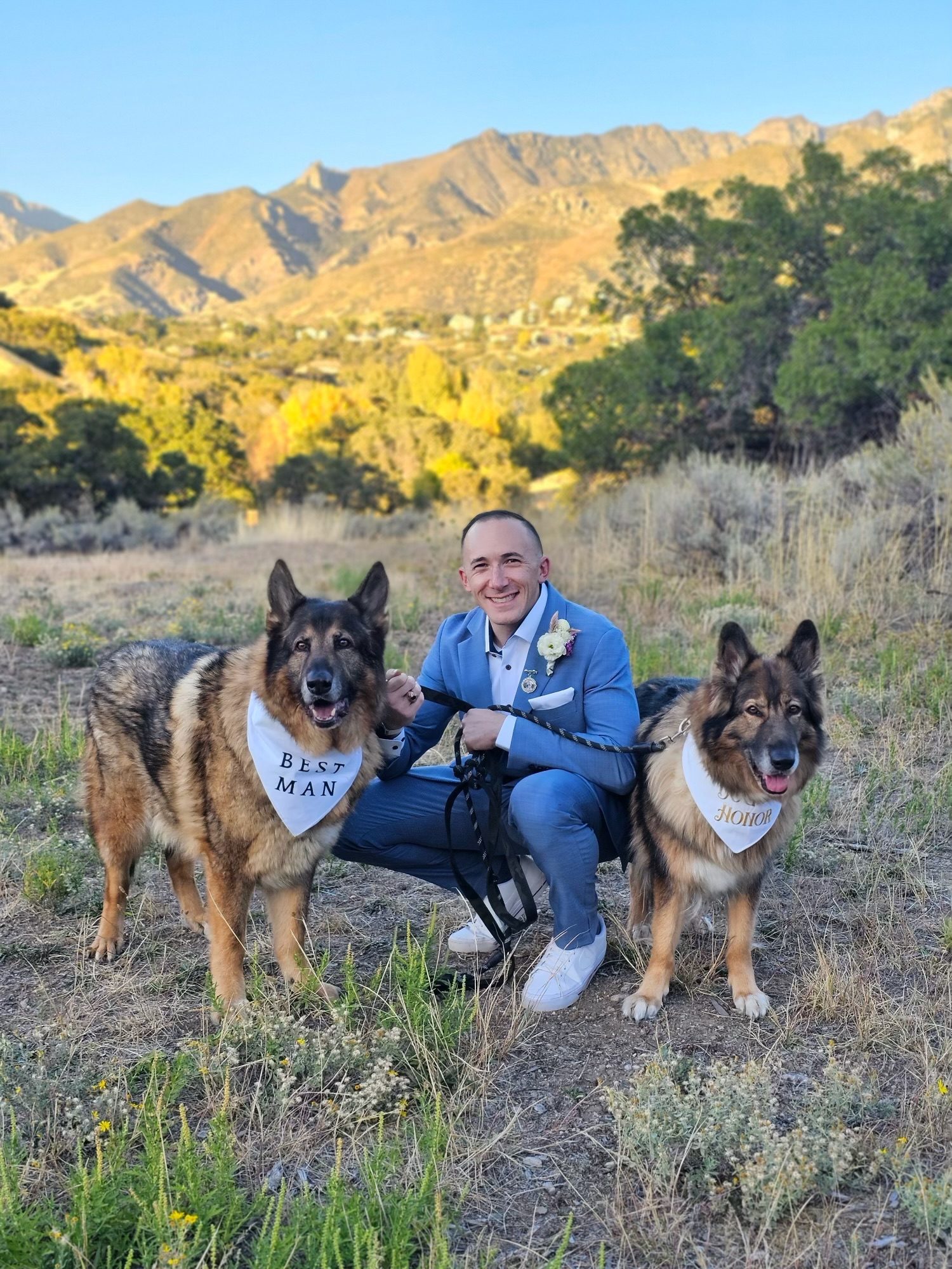 Adam with his German Shepherds in the Utah foothills